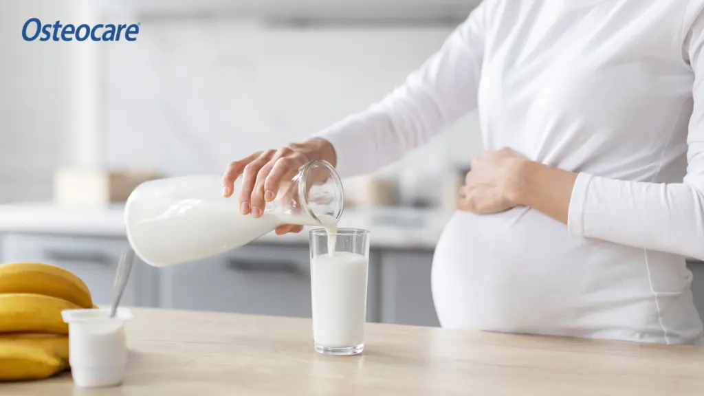 Pregnant women pouring milk for calcium and bone health support